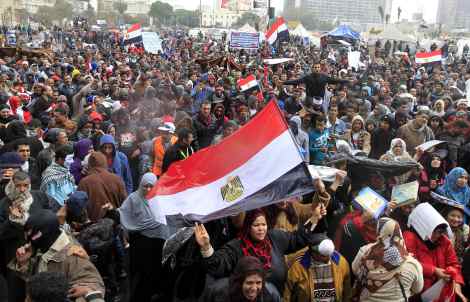 Anti-Mursi protesters chant anti-government slogans at Tahrir Square in Cairo